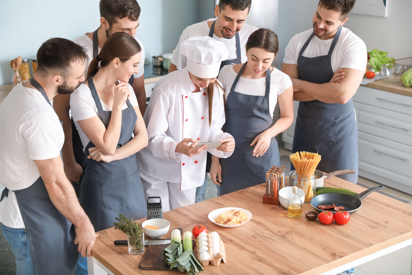 Female Chef and Students During Cooking Class